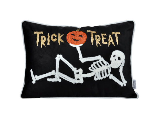 Halloween-themed pillow with skeleton, pumpkin, and &