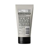 Back view of vitamin-infused exfoliating face wash tube with ingredients list