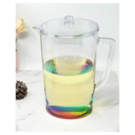 Unbreakable 2.75 Quarts Drink Pitcher filled with lemonade, showcasing its BPA free design and vibrant multicolor base on a marble countertop.