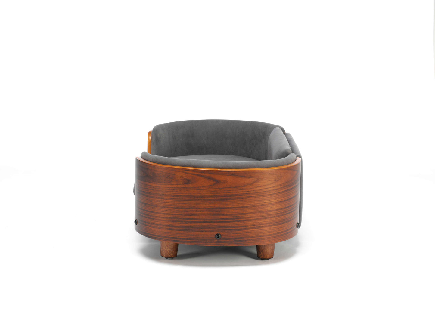 Side profile of Scandinavian Elevated Dog Bed showing curved wooden backrest and elevated legs for airflow and modern pet furniture design.