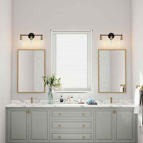 Bathroom vanity with two mirrors, lights, and a window.