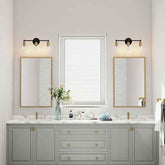 Bathroom vanity with two mirrors, lights, and a window.