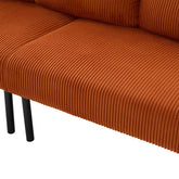 Close-up of a brown corduroy sofa with black legs on a white background