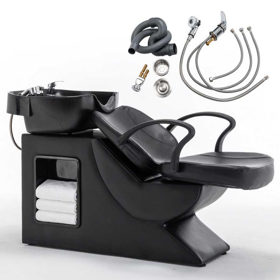 Barber shampoo station with black chair and accessories