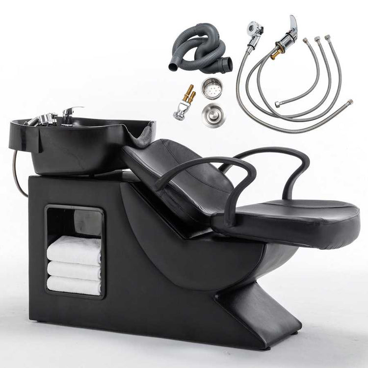 Barber shampoo station with black chair and accessories