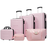 Set of pink luggage including suitcases and a handbag on a white background