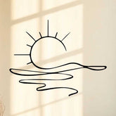 Minimalist sunrise wall art with metal sun and water design