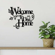 Floral wall art reading 'Welcome to Our Home' mounted above a console table, perfect for entryway decor in home and garden settings.
