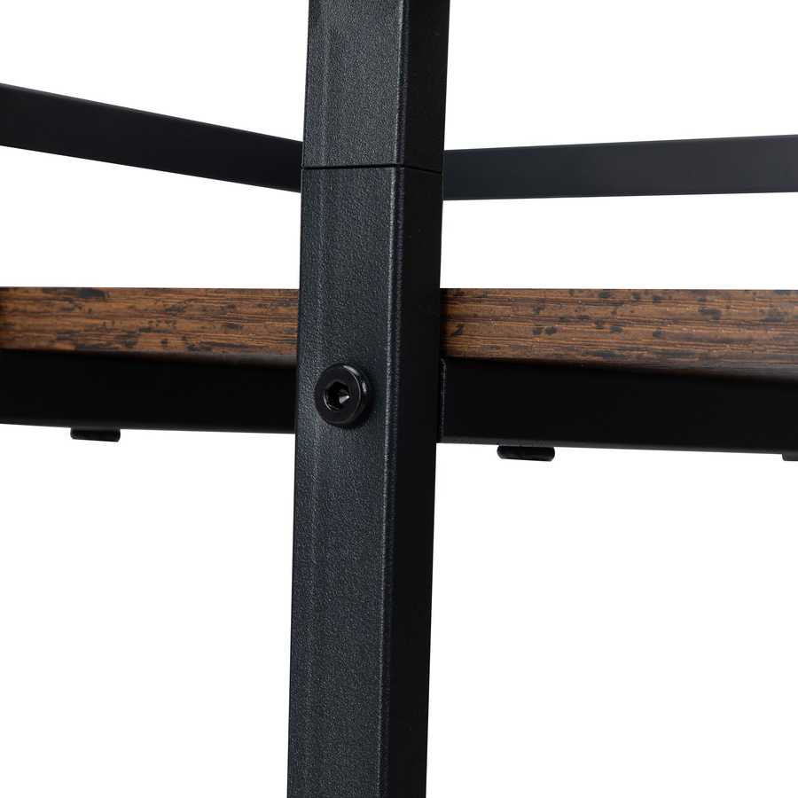 Wooden surface of salon cart with black metal frame, showing rustic finish