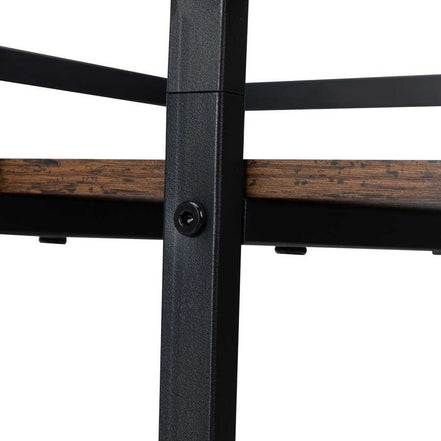 Wooden surface of salon cart with black metal frame, showing rustic finish