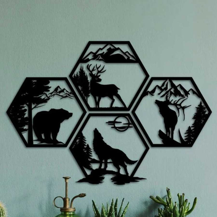 Iron Hexagon Forest Animal Wall Art Set on green wall, 4-piece black metal artwork with bear, deer, elk, and wolf silhouettes for nature-inspired home decor.