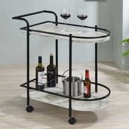 Faux marble serving cart with wine rack featuring two-tier shelves, wine bottles, glasses, and ice bucket on lockable caster wheels.