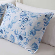 Close-up of floral pillow sham from the Twin Floral Striped Duvet Cover Set - Twin Duvet Cover Set Floral, featuring soft blue watercolor roses.
