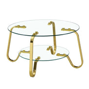 Freestanding vintage metal coffee table with round glass top and bottom shelf, gold curved legs for modern appeal.