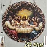 A circular decorative wall hanging or print depicting the Last Supper, with Jesus seated at a table surrounded by his disciples. The artwork is shown against a light gray background, with a small inset at lower left showing the hanging edge and a yellow &