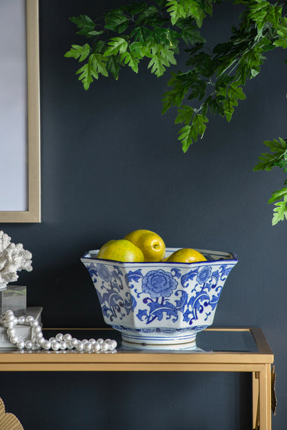 Blue and White Decorative Bowl - Porcelain, Elegant Design used as a fruit bowl on a gold table, enhancing dark wall decor.