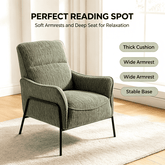 A green upholstered recliner armchair with black metal legs, shown in a bright room with text callouts describing its features: &