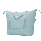 Light blue tote bag with a visible brand label on a white background