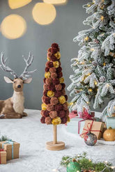 Christmas tree table decor beside a deer figurine