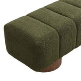 An olive green bouclé upholstered bench with a cylindrical wooden base, shown on a clean white background.