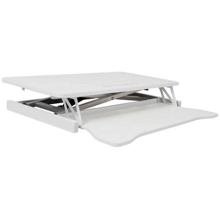 Adjustable standing laptop desk in fully lowered position. Compact and sleek design for modern office furniture solutions.