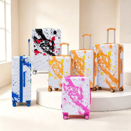 Set of colorful suitcases with abstract designs on a neutral background
