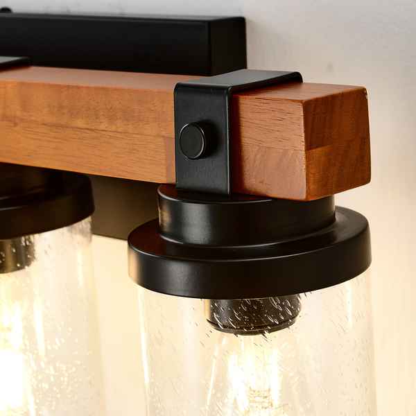Close-up of a wall-mounted light fixture with wooden and metal design.