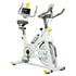 White exercise bike with digital display on a white background
