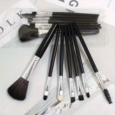 Makeup Brush Set - Essential Beauty Tools| Facial & Eye black cosmetic brushes with silver ferrules displayed on a magazine layout for beauty lovers.