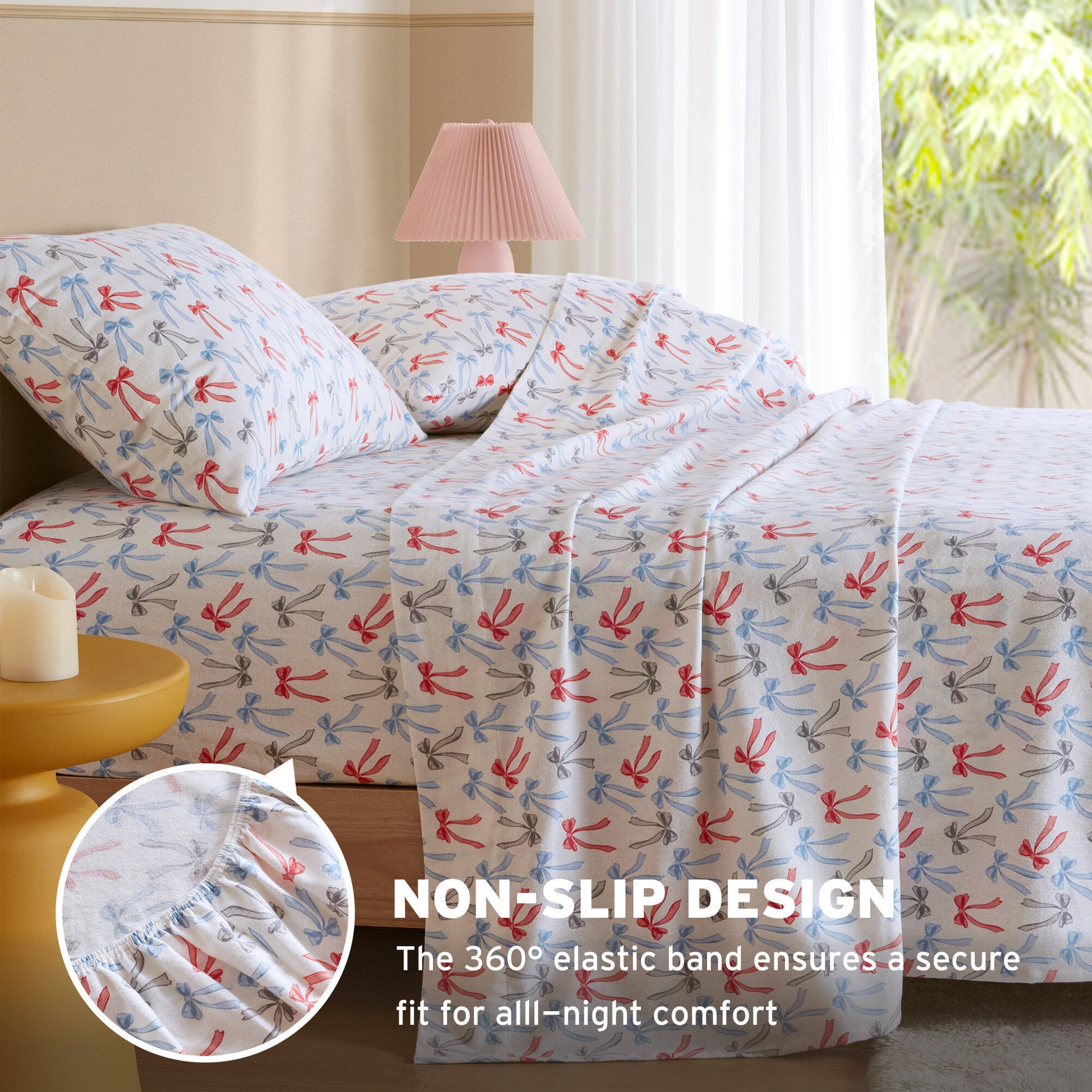 Happy Bows flannel sheet set on bed with inset showing 360° elastic band for non-slip fitted sheet design.