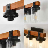 Wooden and black wall-mounted light fixture with glass shades on a white background.
