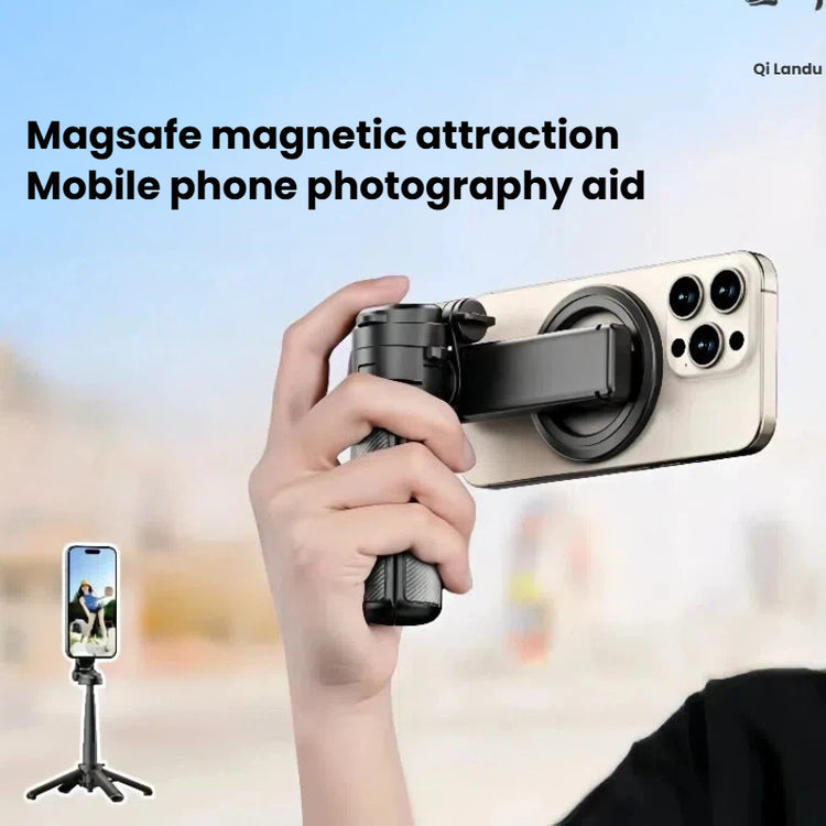 A hand holds a black magnetic phone tripod attachment against a blurred outdoor background, with a smartphone mounted on the device. Text at the top reads &
