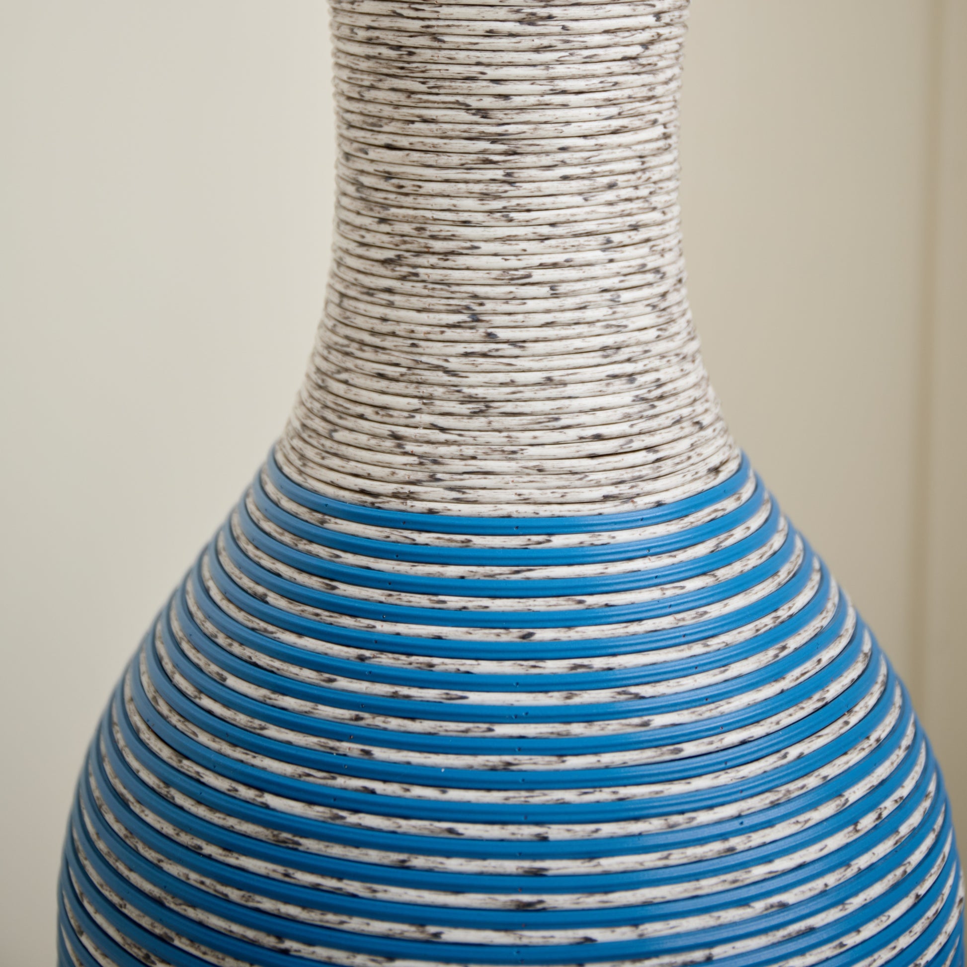 Close-up of the 39-inch floor vase decor showing its durable PVC texture with blue and white striped design. Perfect for stylish home accents.