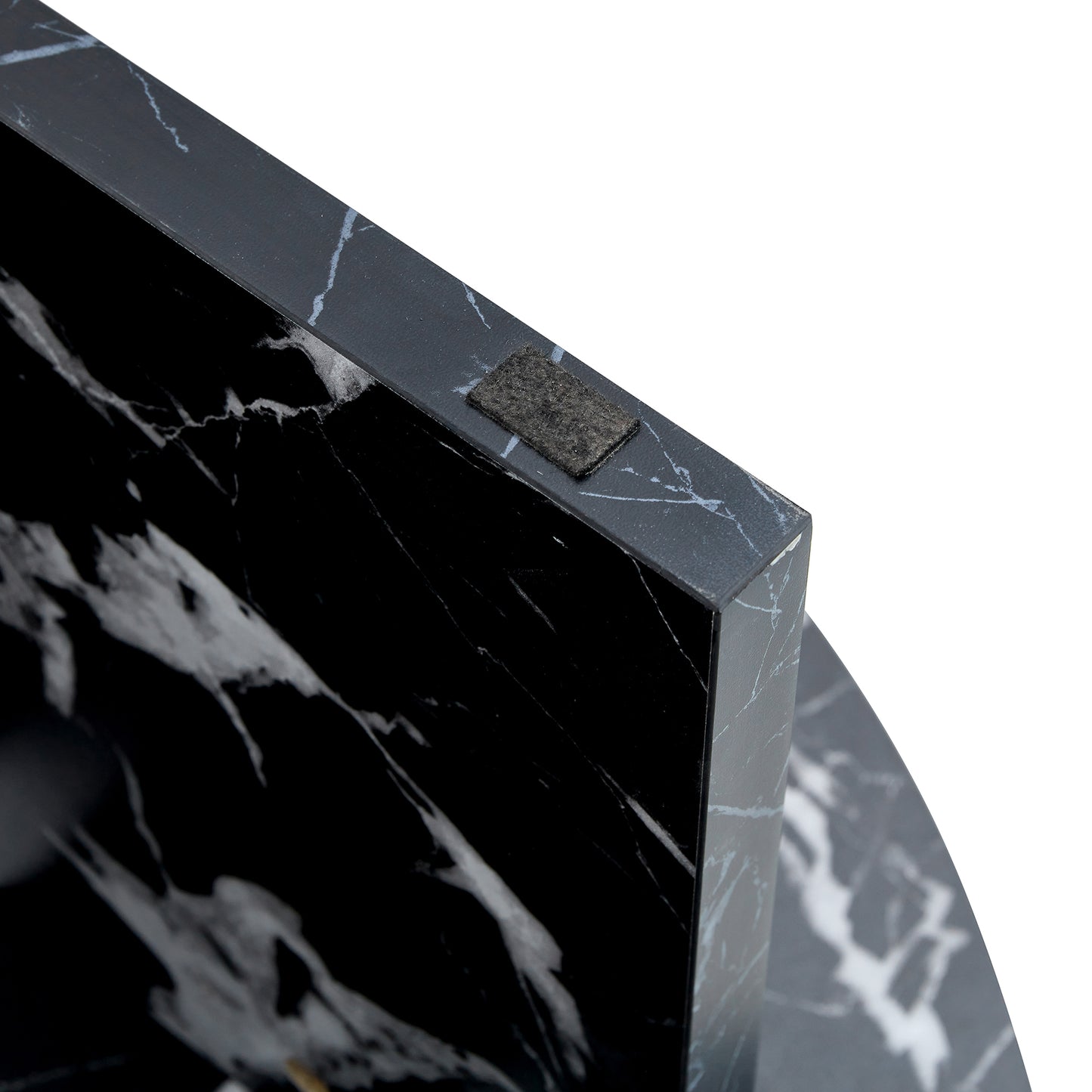 Underside of black MDF round coffee table leg with felt pad, designed to protect floors and enhance stability.