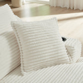 Stack of white textured towels on a wooden floor
