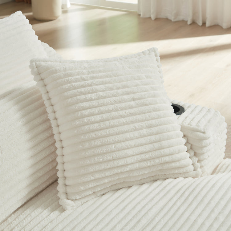 Stack of white textured towels on a wooden floor