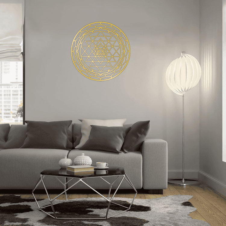 CIFbuy Sacred Mandala Wall Art in gold aluminum on a light gray wall above a modern sofa. Adds serene charm to contemporary living rooms.