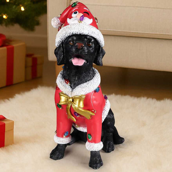 Christmas Labrador statue in Santa outfit, close-up