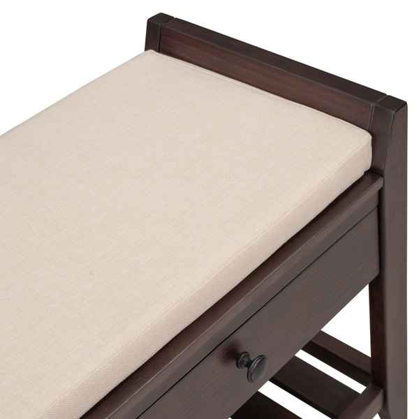 Wooden changing table with a beige cushion on a white background