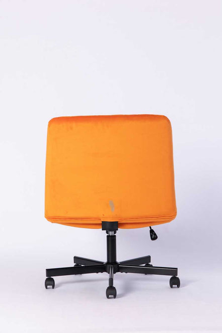 Back view of the Orange Velvet Office Chair highlighting its sleek, minimal design and sturdy rolling base.