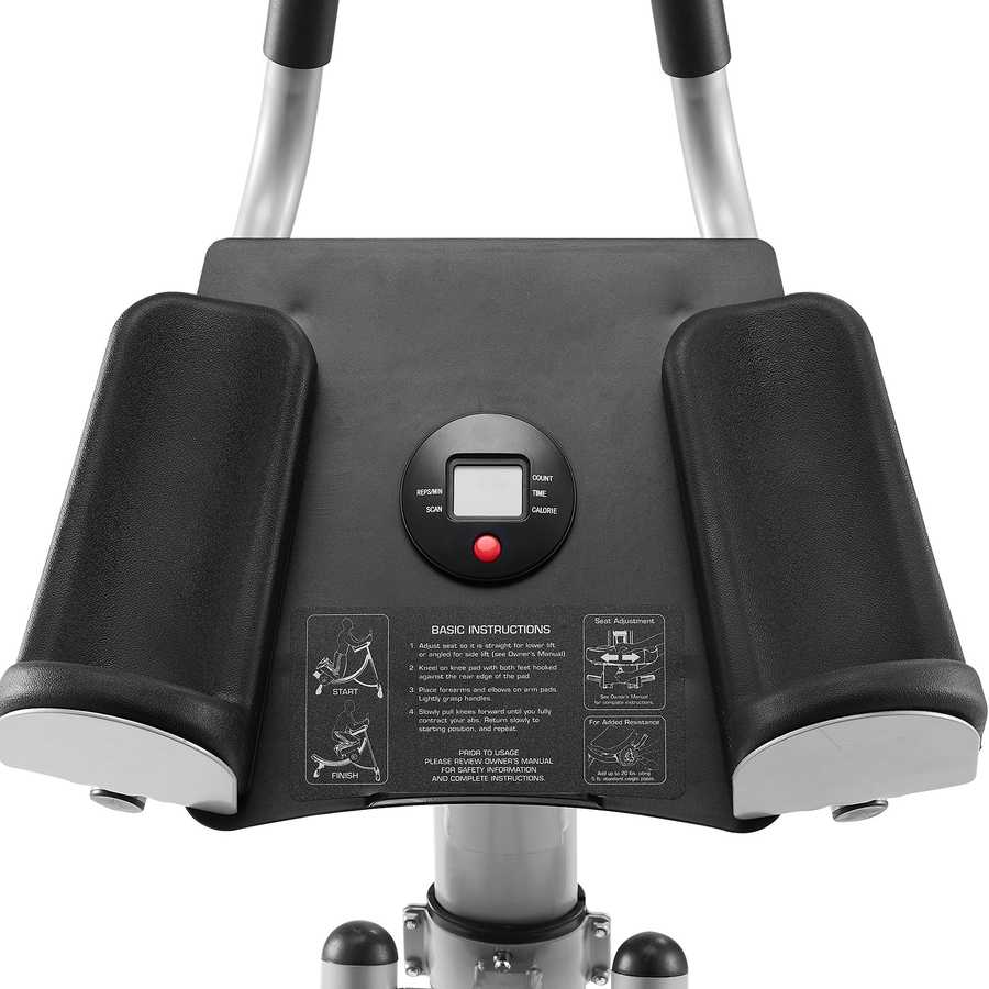 Close-up of a black and silver exercise device with control panel on a white background