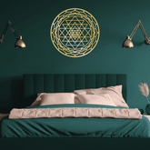 CIFbuy Sacred Mandala Wall Art in gold aluminum above a teal bed in a dark green room. A bold spiritual accent for bedroom walls.
