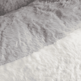 Close-up of gray and white fur fabric texture