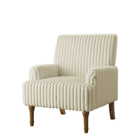 Beige armchair with wooden legs in a room with light pink walls and a window.