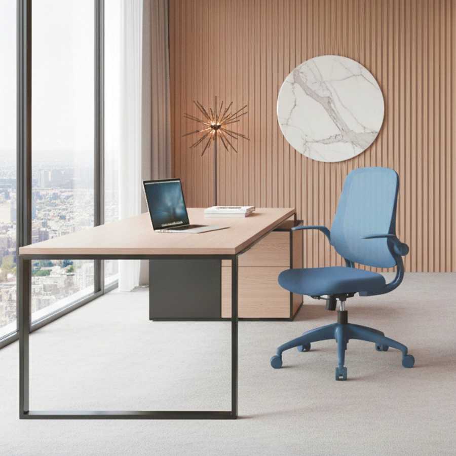 Modern office desk with a blue chair in a room with large windows and decorative wall art.