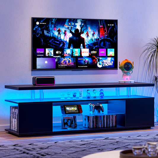 a flat screen tv sitting on top of a tv stand