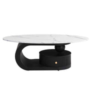 Oval coffee table from Nesting Coffee Table Set with white marble-style top and black base featuring a built-in drawer for storage.