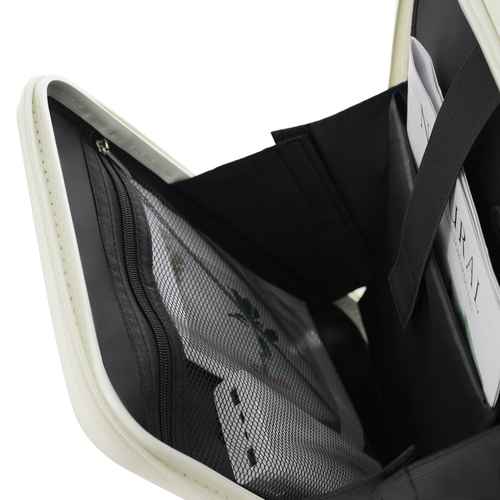 Close-up of an open black organizer pouch or wallet with a white outer edge, showing interior compartments, mesh pockets, and card slots.