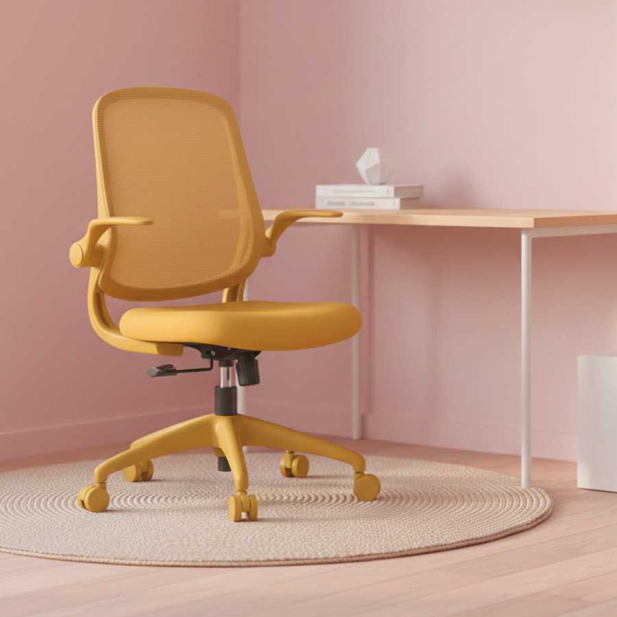 Yellow office chair in a room with a pink wall and wooden desk.