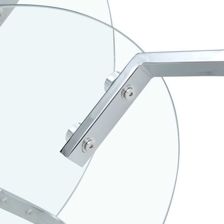 Close-up of angled chrome leg and glass attachment on the Vintage Metal Frame Coffee Table - Glass Top | 31.5 Inches.